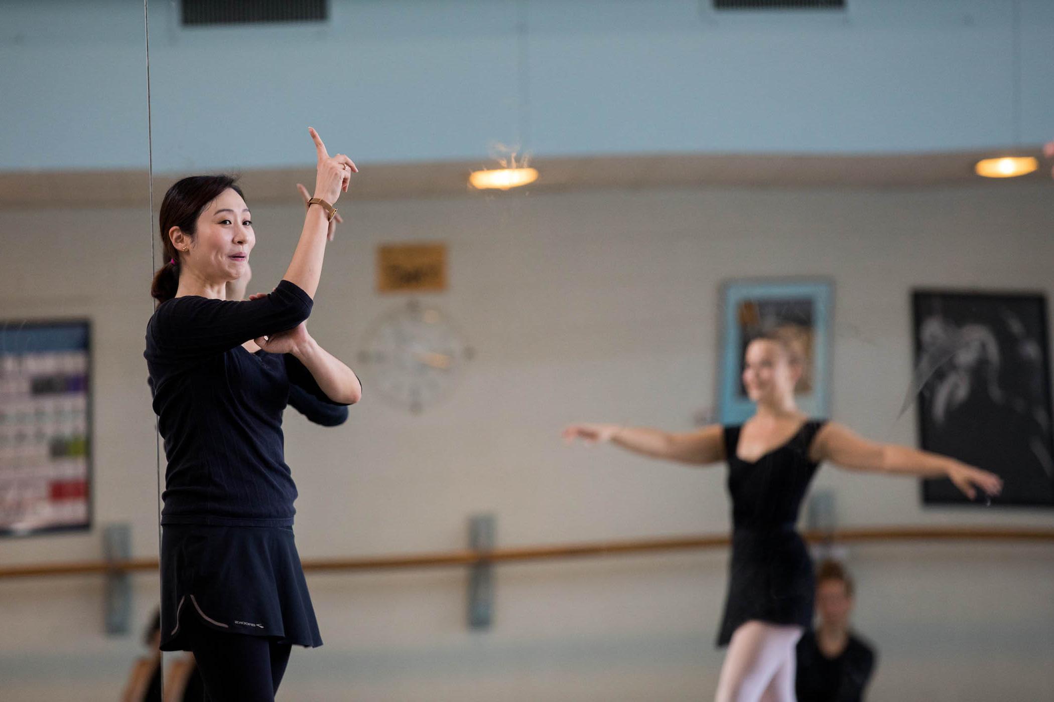 Visiting artist Eun Kyung Chung gives notes in dance class